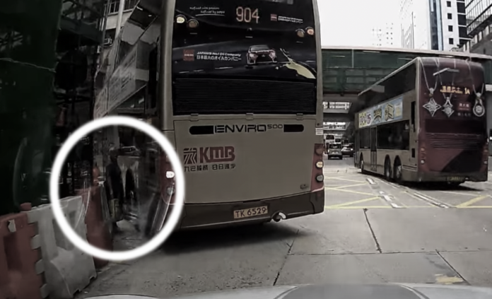 Elderly woman narrowly avoids being hit by a bus while trying to cross ...