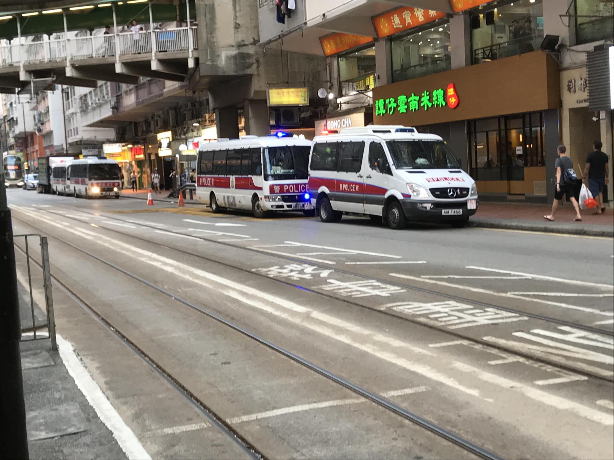 Police on standby in North Point as mobs in white call back-up from ...