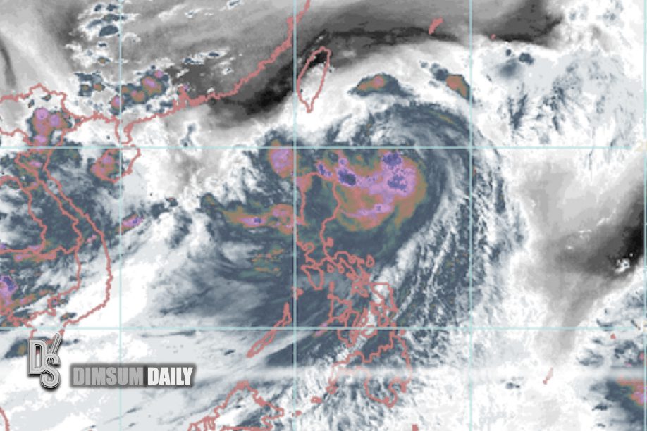 A typhoon with a well-defined eye and spiral clouds is approaching southeastern China, with heavy rain and storm systems surrounding it.