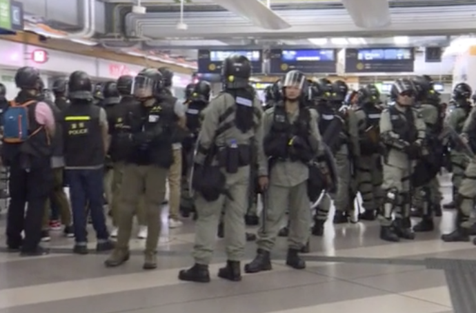 Protesters in stand off with riot police at Tin Shui Wai MTR Station ...