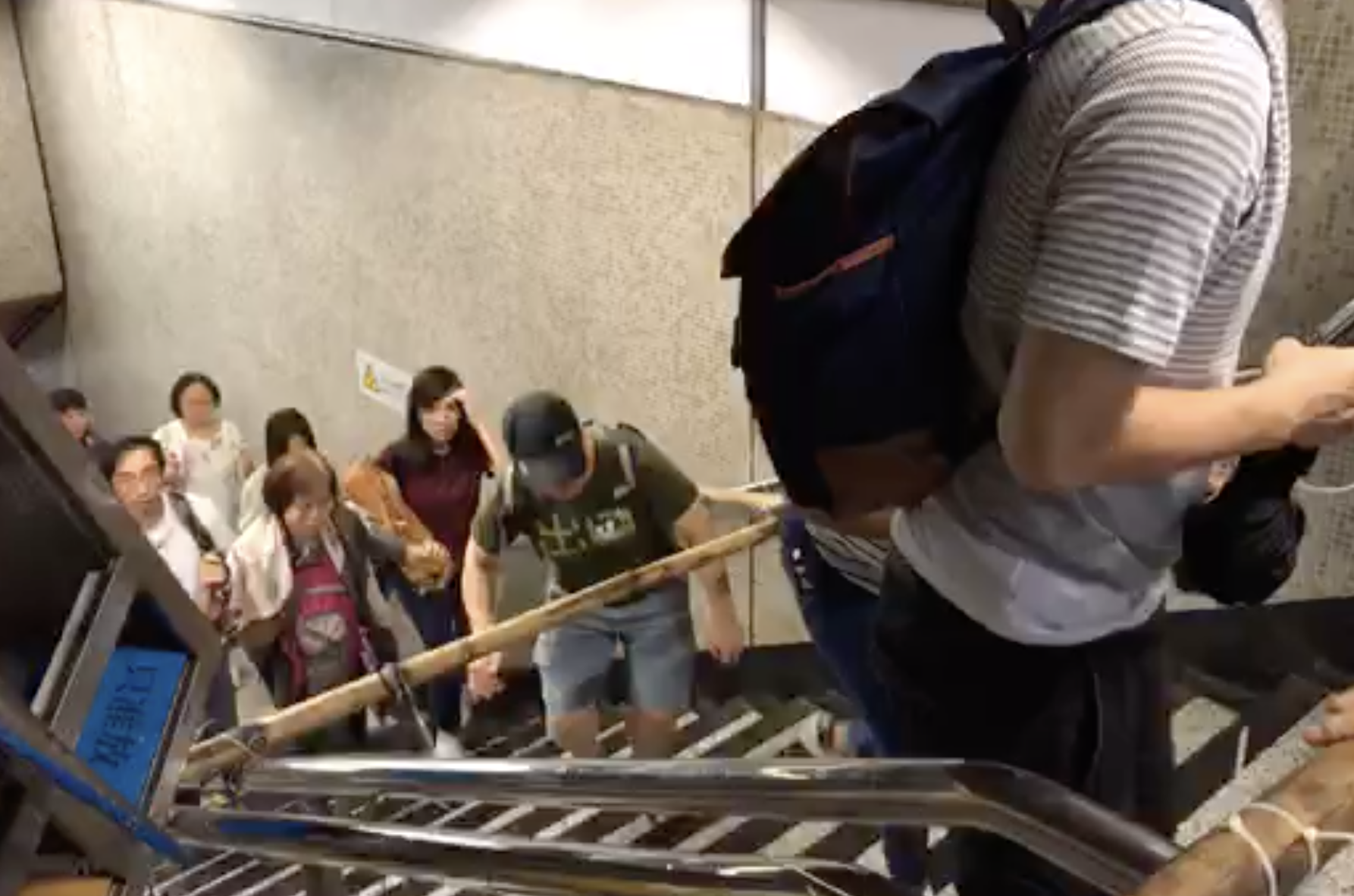 Woman arrested for jumping over turnstile in Yau Ma Tei MTR Station, protesters block exits