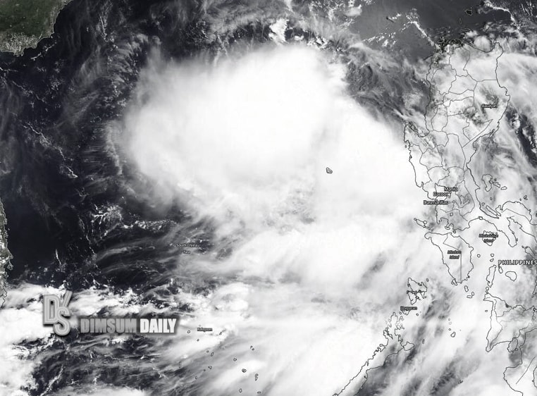 A massive tropical cyclone with heavy squally showers and thunderstorms is depicted, affecting the northern Philippines and nearby regions, with weather signals displayed indicating a tropical cyclone standby and strong wind alerts.