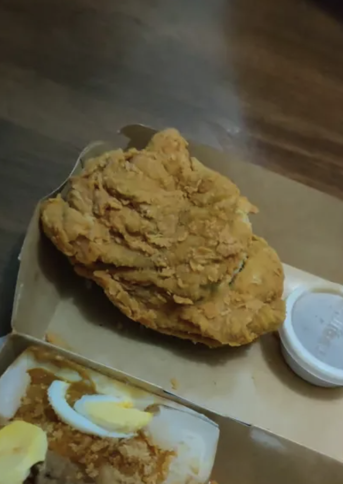 Deepfried towel instead of fried chicken served in a takeaway by