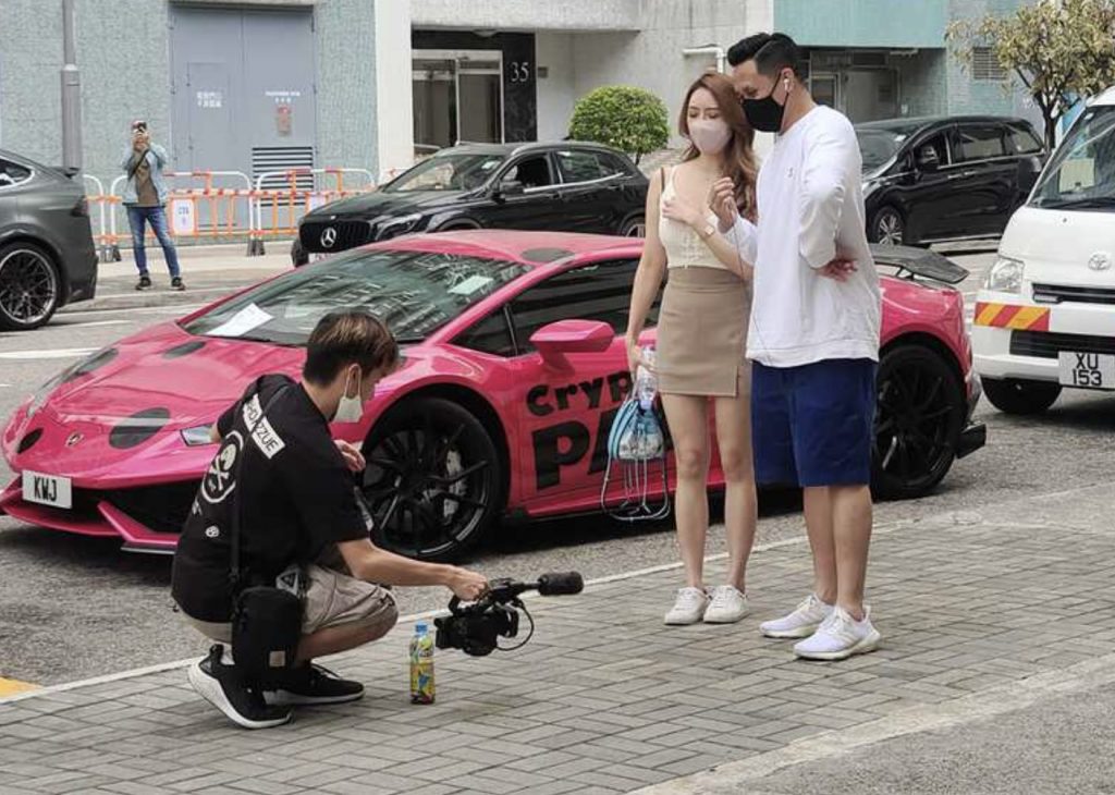 Dark pink Lamborghini sports car clamped near City One - Shatin during ...