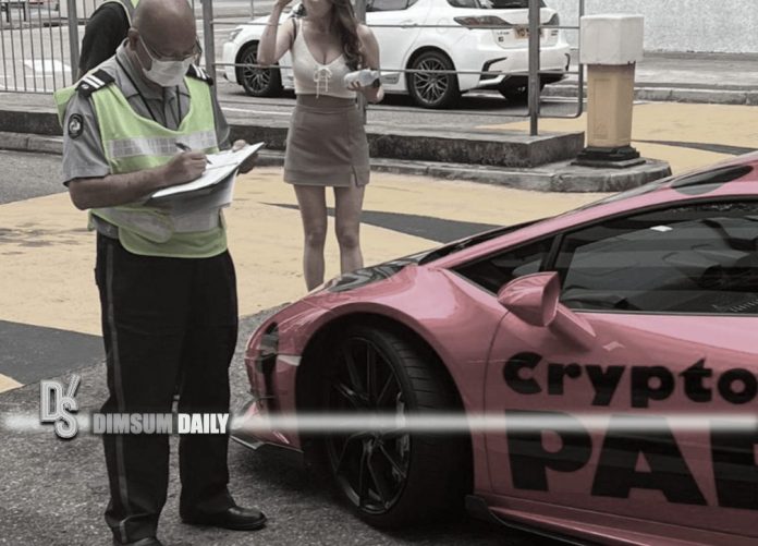 Dark pink Lamborghini sports car clamped near City One - Shatin during ...