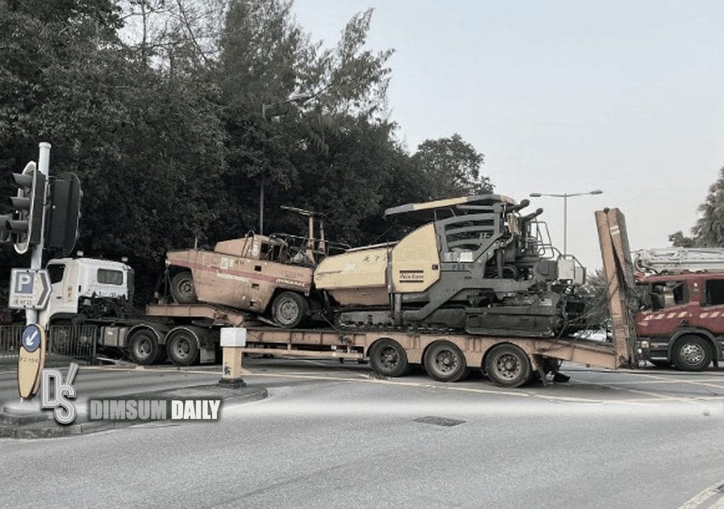 Flatbed truck carrying two heavy-duty machines crashes into car in Sai ...