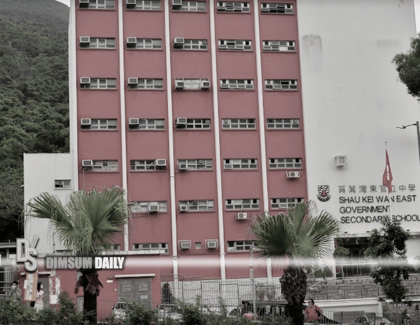 Student climbs onto ledge of building at Shau Kei Wan East Government