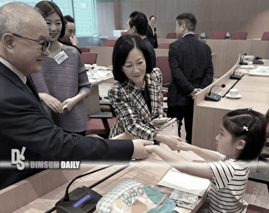 Lawmaker Eunice Yung's daughter draws during Hang Seng University event