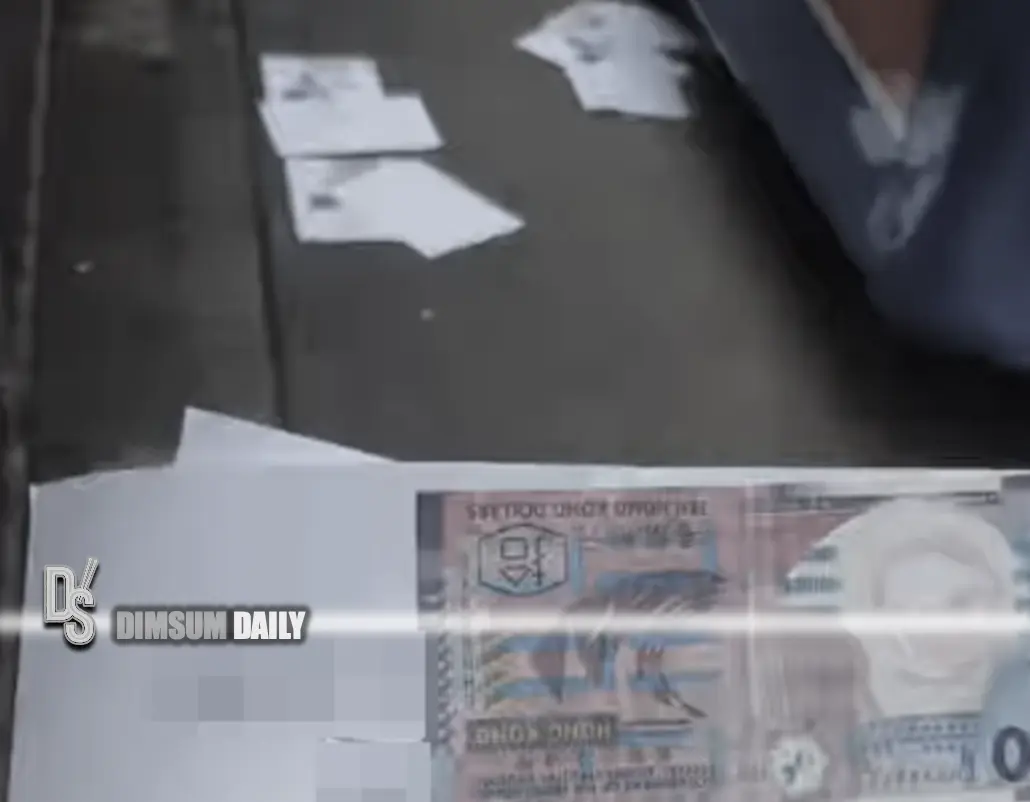 Debt collection notices featuring HK10 notes scatter across Sheung Wan