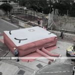 Woman stands precariously by apartment window at Hong Fung House in Tsing Yi