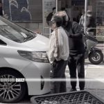 Tension erupts in Mong Kok as Tesla driver confronts seven-seater vehicle, South Asian biker steps in