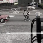 Two young men endanger themselves crossing road at Cross Harbour Tunnel