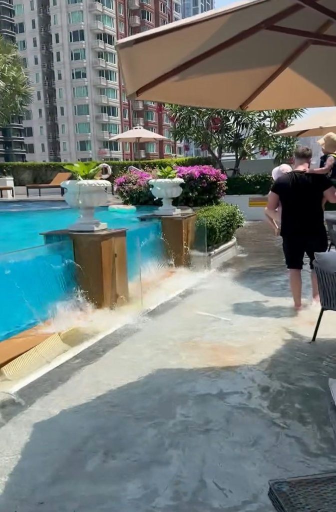 Father rescues children after hotel pool glass wall shatters during ...