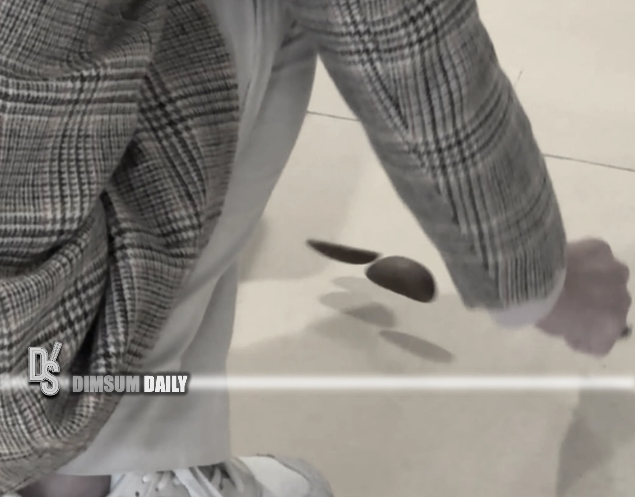 Mall shopper in Ma On Shan seen casting divination blocks beside bin