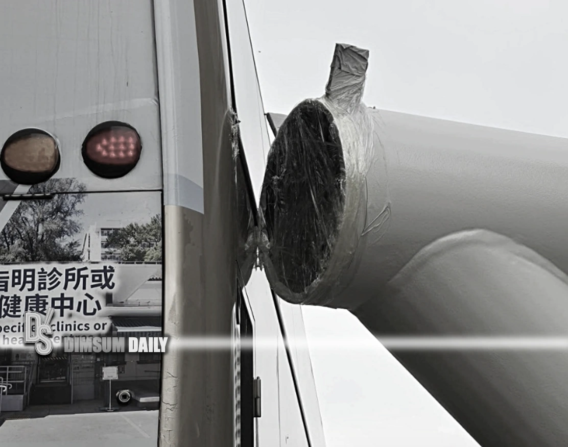 Truck load scrapes KMB bus in Yuen Long