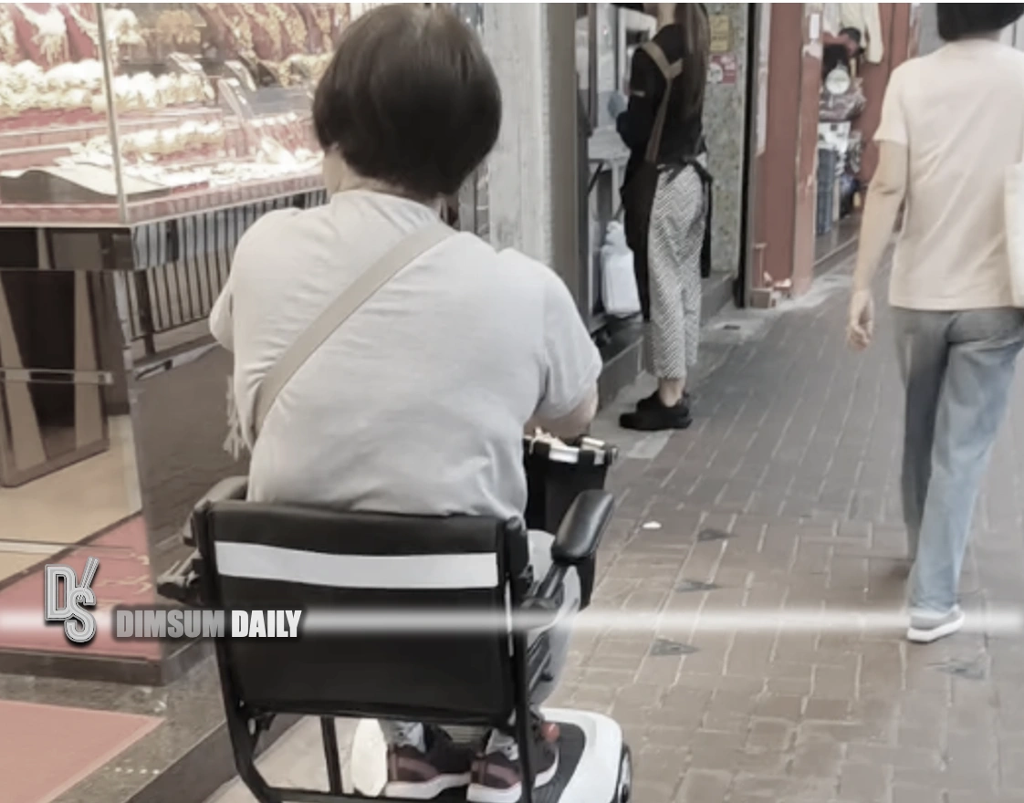 Woman seen allegedly using illegal mobility scooter in Sai Wan