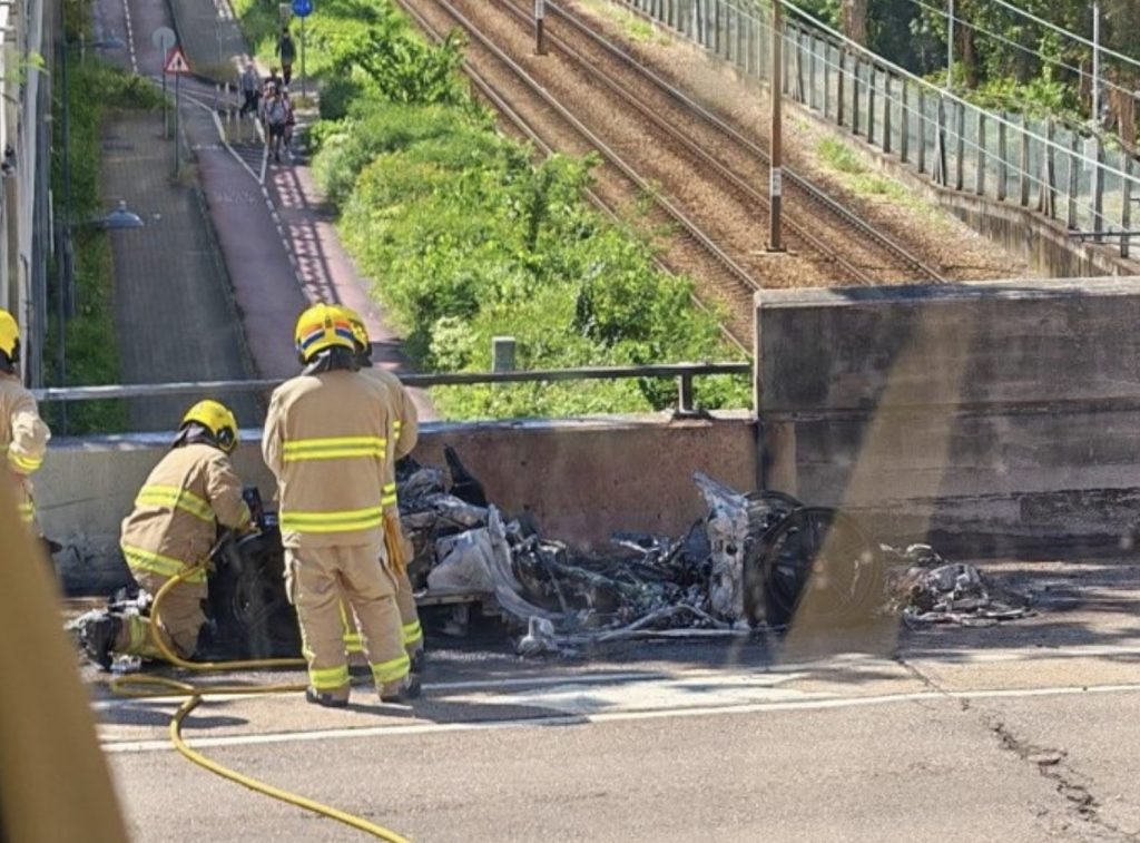 Red Ferrari catches fire while driving in Tuen Mun as driver escapes unhurt
